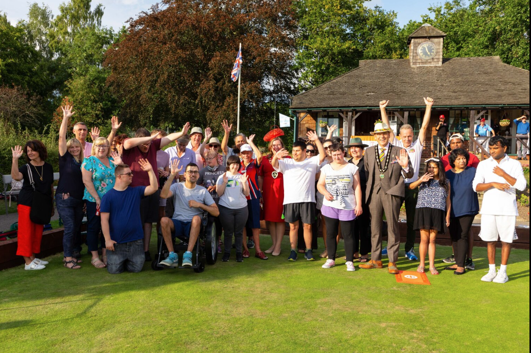 Addlestone high street with local businesses and families